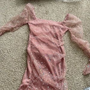 A pink long sleeve dress